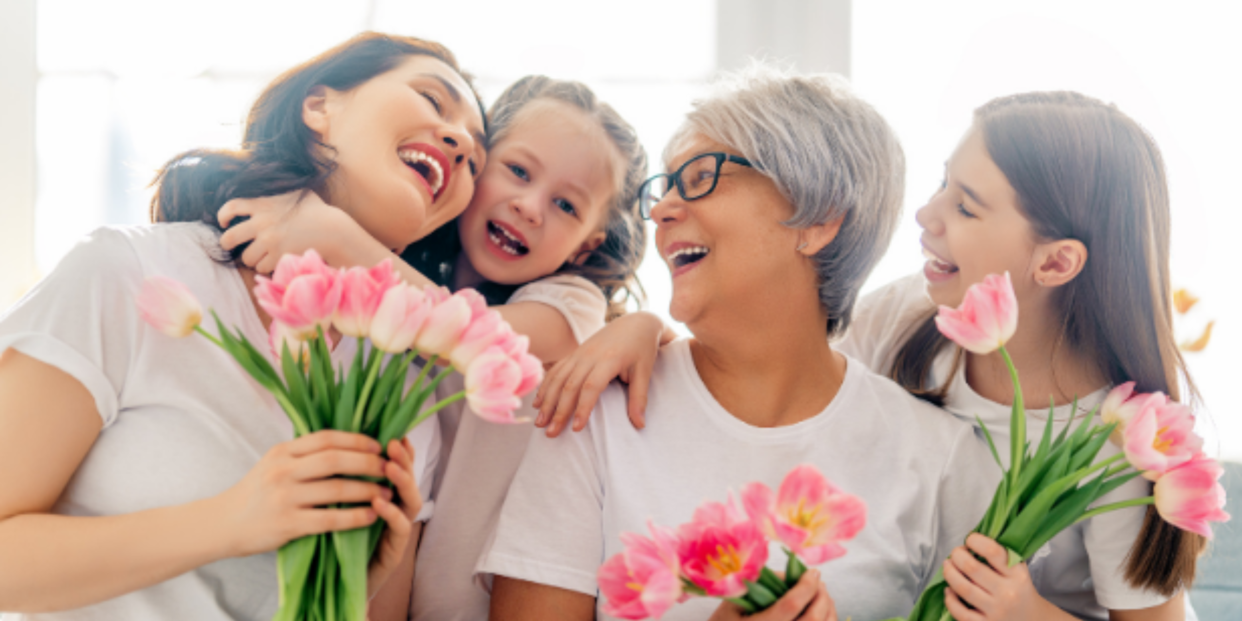 8 Dates to Celebrate in March: This is a photo of a family of women holding tulips.