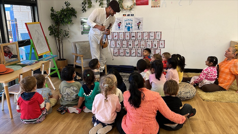 a presenter communicating witih his students, ensuring they are all engaged and listening